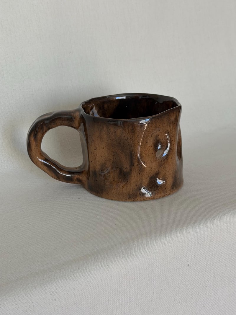 Ear handle mug, mottled, a handbuilt ceramic mug with a mottled brown glaze and one flat pressed handle, 11 oz