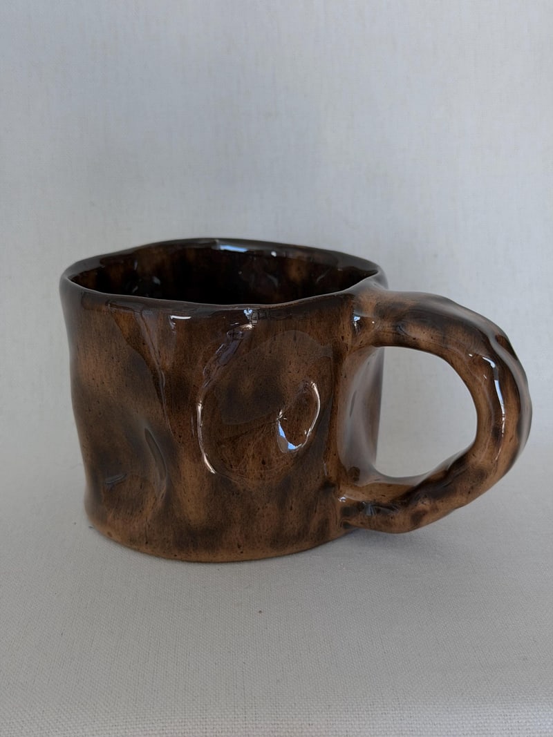 Ear handle mug, mottled, a handbuilt ceramic mug with a mottled brown glaze and one flat pressed handle, 11 oz