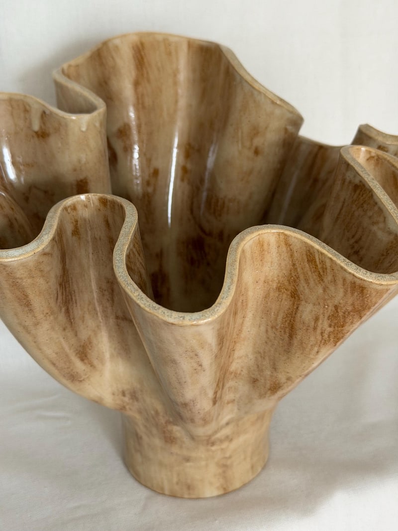 Frill vessel, a handbuilt ceramic vase with a waved rim under a warm glaze, 11 in tall