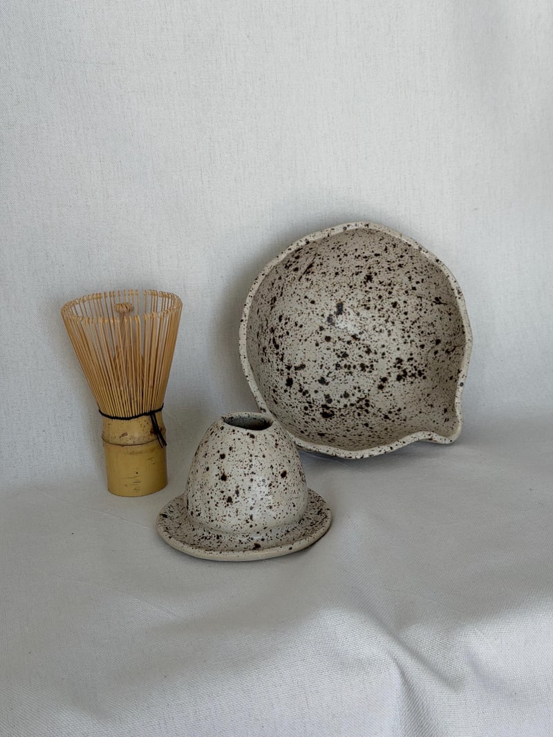 Matcha set II, a handbuilt speckled ceramic bowl with a bamboo whisk and a whisk rest