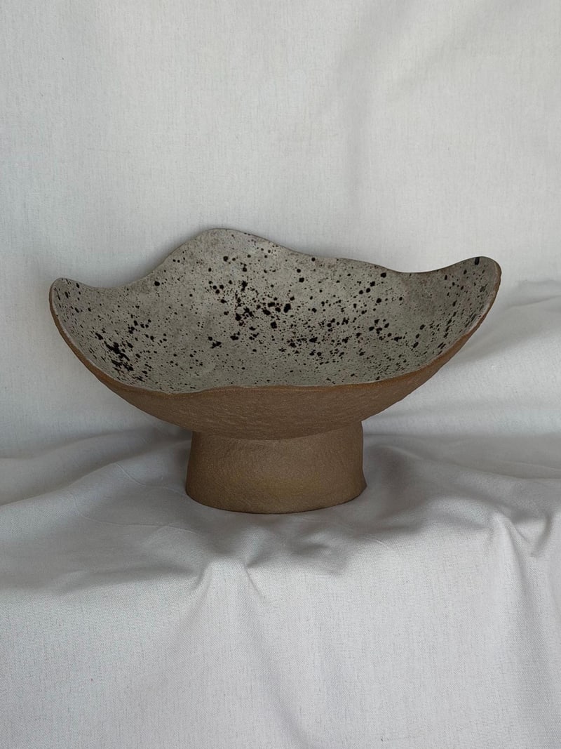 Pedestal bowl, speckled, a handbuilt ceramic bowl with a speckled glaze on a footed base