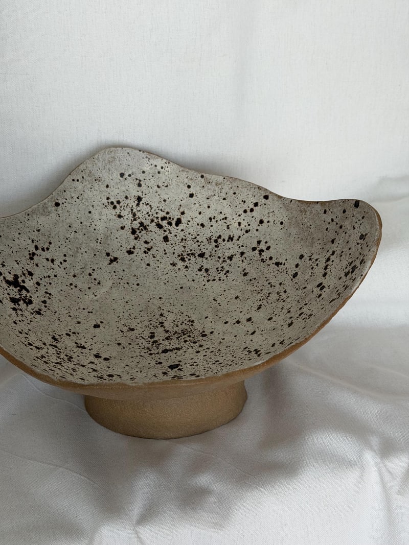 Pedestal bowl, speckled, a handbuilt ceramic bowl with a speckled glaze on a footed base