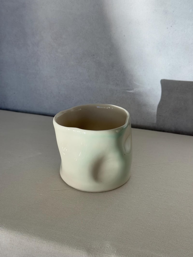 Platinum effect vase, a handbuilt ceramic vessel with a metallic platinum glaze, 9 in tall