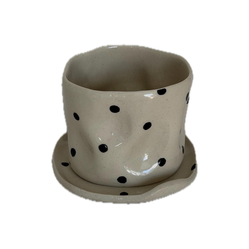 Polka cup and saucer, a handbuilt ceramic cup with black dots on a matching saucer, 8 oz